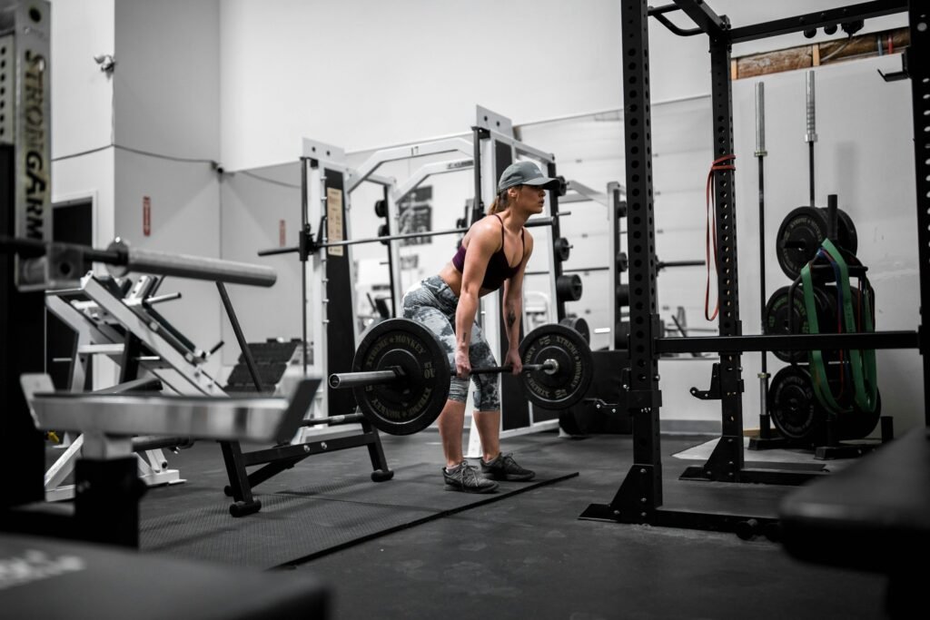 A female athlete demonstrates impressive bodybuilding skills with a powerful pose, showcasing the dedication and strength required in female bodybuilding.